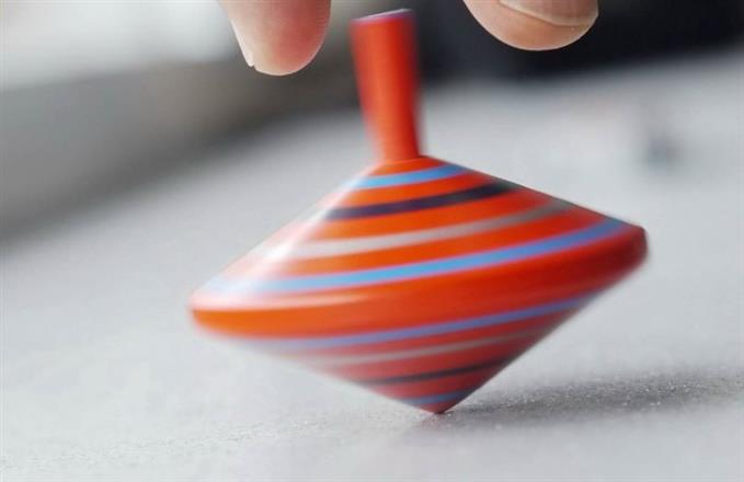 spinning top with hand