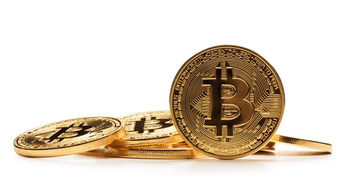 Bitcoin Prices Lag Behind Tech Heavy Nasdaq Ahead of Major Earnings
