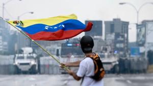 person holding a venezuela flag