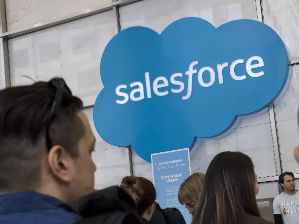 People looking at Salesforce logo after Tableau purchase