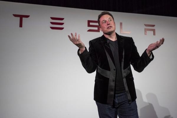 Tesla share price on watch as company changes Bitcoin policy