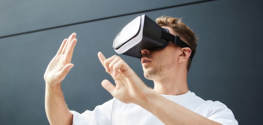 Man wearing a virtual reality headset with Decentraland, a top ethereum dapp